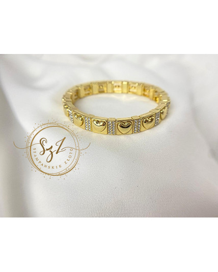 Bransoletka sztywna na gumce serca stal szlachetna pozłacana